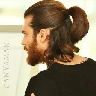 This image shows the guy with a ponytail to visualize the look for a gym hairstyle.