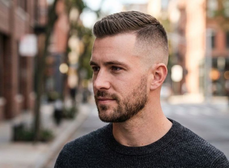 This image shows the man with a high and tight haircut to understand the look you can get with it.
